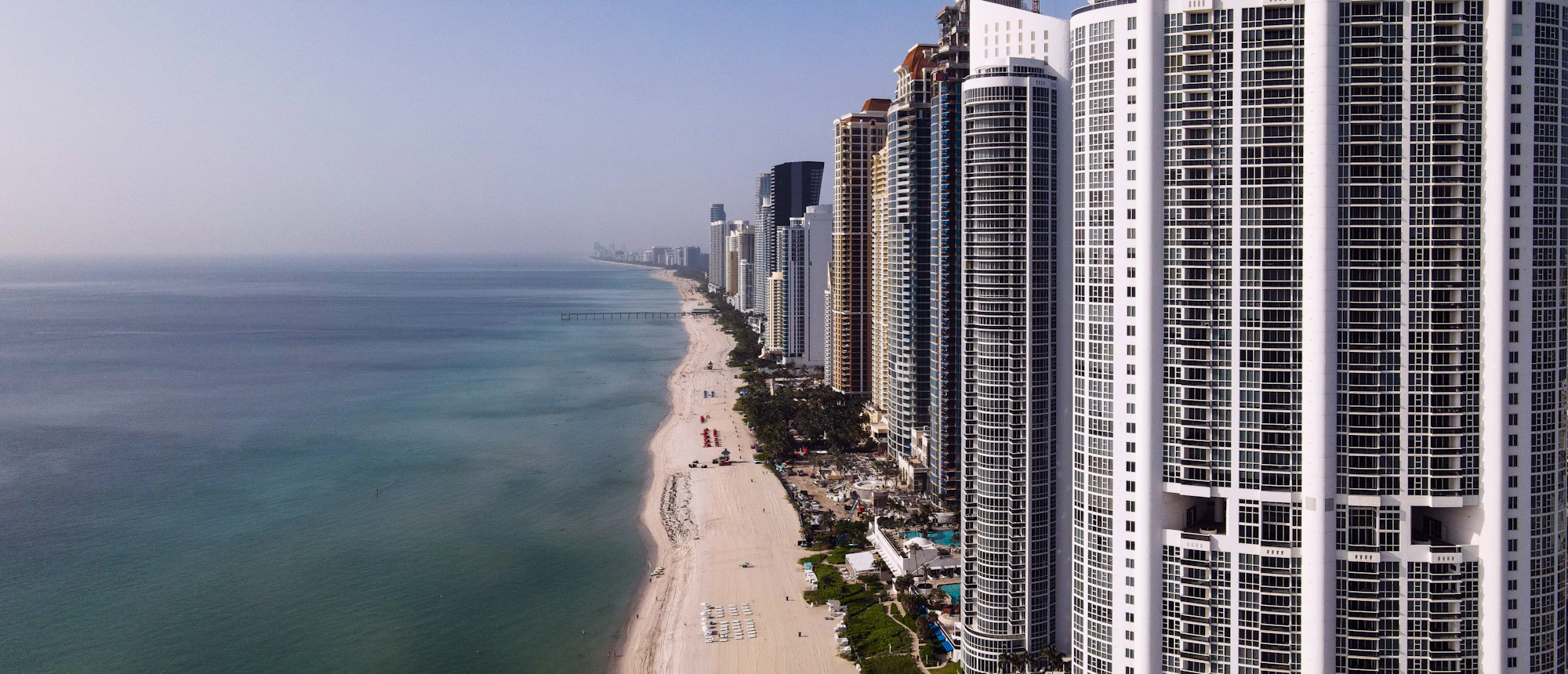 Oceanfront condominium towers lining the beach in Sunny Isles Beach, Florida